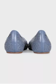 Ballet flats decorated with perforations