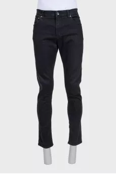 Men's black tapered fit jeans with buttons