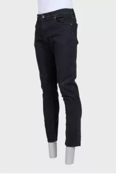 Men's black tapered fit jeans with buttons