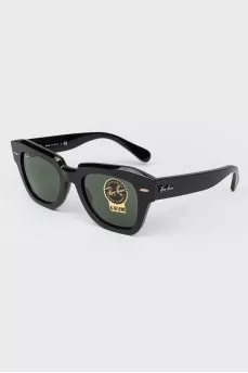 Rectangular black sunglasses with tag