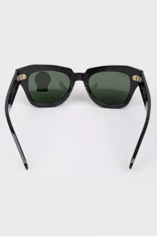 Rectangular black sunglasses with tag