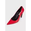 Red patent leather pumps