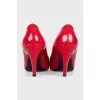 Red patent leather pumps