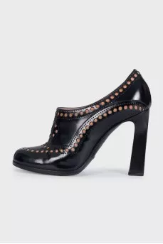 Black leather shoes with perforations