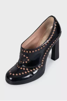 Black leather shoes with perforations