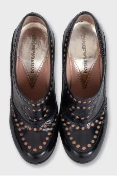 Black leather shoes with perforations