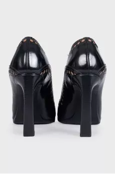 Black leather shoes with perforations