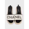 Black and white flip flops with a patch