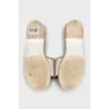 Black and white flip flops with a patch