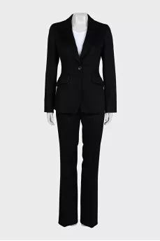 A suit consisting of a fitted jacket and straight trousers
