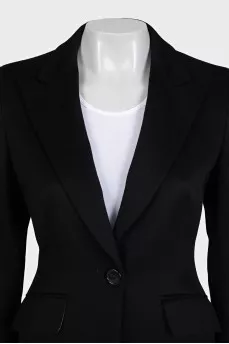 A suit consisting of a fitted jacket and straight trousers