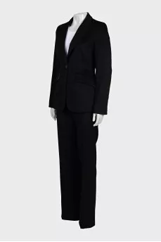 A suit consisting of a fitted jacket and straight trousers