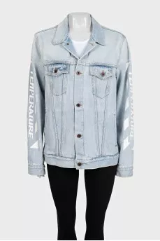 Blue denim jacket with a signature print