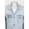 Blue denim jacket with a signature print