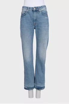 Light blue jeans with a distressed effect