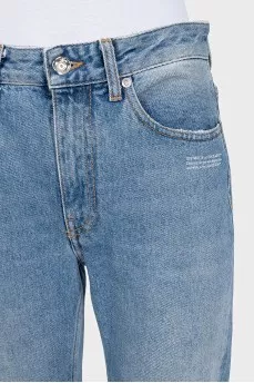 Light blue jeans with a distressed effect