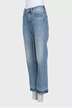 Light blue jeans with a distressed effect