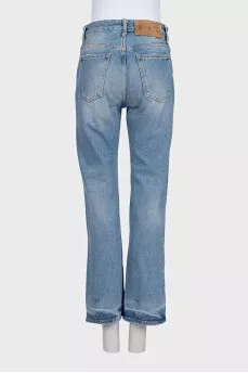 Light blue jeans with a distressed effect