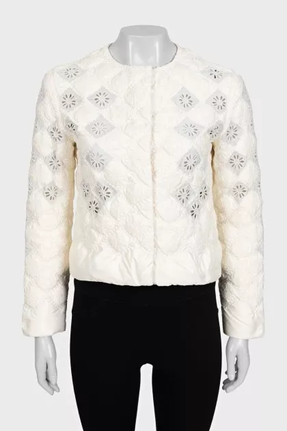 Straight jacket decorated with perforations