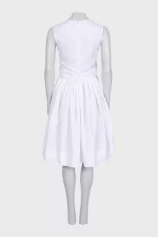 Fitted white dress with perforations