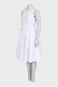 Fitted white dress with perforations