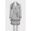 A checkered suit decorated with embroidered frills