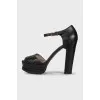 Black leather sandals with a chunky sole