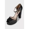 Black leather sandals with a chunky sole