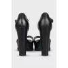 Black leather sandals with a chunky sole