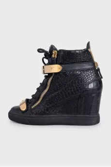 Black leather sneakers with gold hardware