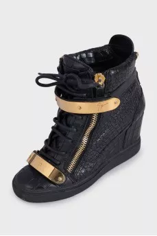 Black leather sneakers with gold hardware