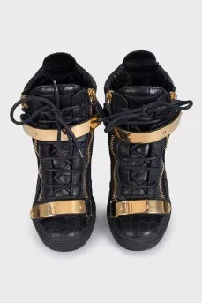 Black leather sneakers with gold hardware
