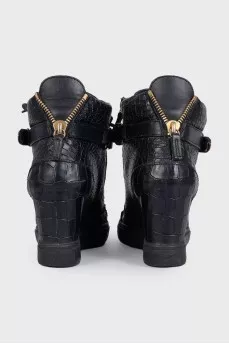 Black leather sneakers with gold hardware