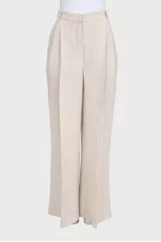 A suit consisting of a button-down jacket and trousers with a tag