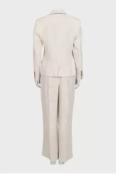 A suit consisting of a button-down jacket and trousers with a tag