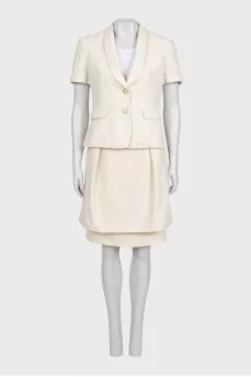 White suit with a skirt and a fitted jacket
