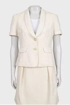 White suit with a skirt and a fitted jacket