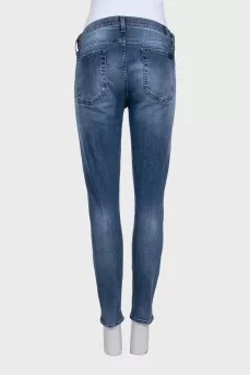 Mid-rise blue jeans with a distressed effect