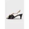 Leather sandals with a gold bow