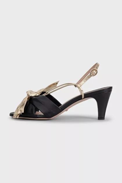 Leather sandals with a gold bow