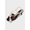 Leather sandals with a gold bow