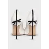 White pumps decorated with a bow
