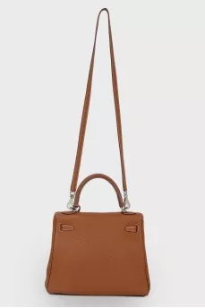 Kelly 25 Bag в коже Clemence карамельного цвета