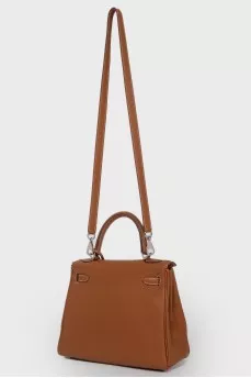 Kelly 25 Bag в коже Clemence карамельного цвета