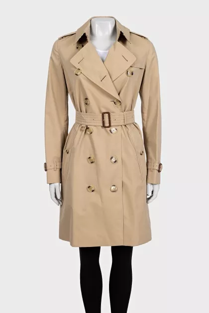 Beige trench coat with leather buckles