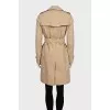 Beige trench coat with leather buckles