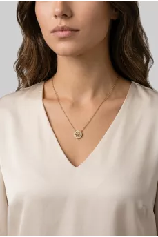 Golden pendant with dancing crystal