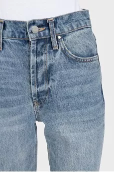 Blue ripped jeans with logo
