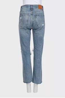 Blue ripped jeans with logo