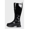 Black patent leather boots with zip and laces